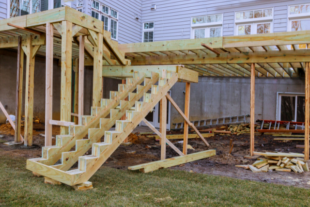 Installing deck boards with above ground deck patio construction